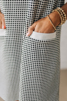 Blonde Woman Wearing a Drop cap sleeves tiny checker print shift dress with pocket, solid contrast accent.
