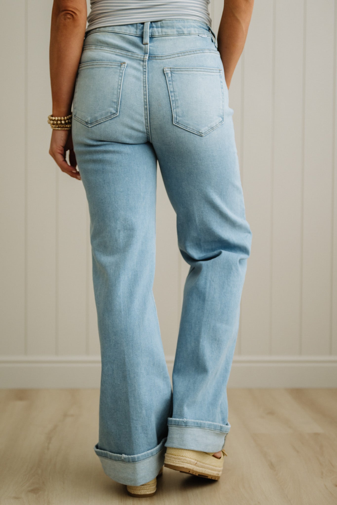 Light blue jeans worn by a person with a neutral background