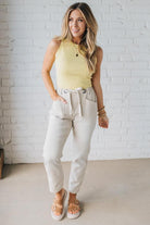 Blonde Woman in a Yellow Tank Wearing Vintage Washed Slim Barrel Pants With Front Patch Pockets and a Chunky Drawstring Waist.
