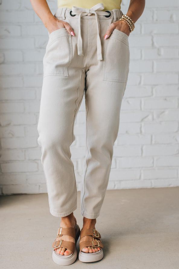 Blonde Woman in a Yellow Tank Wearing Vintage Washed Slim Barrel Pants With Front Patch Pockets and a Chunky Drawstring Waist.