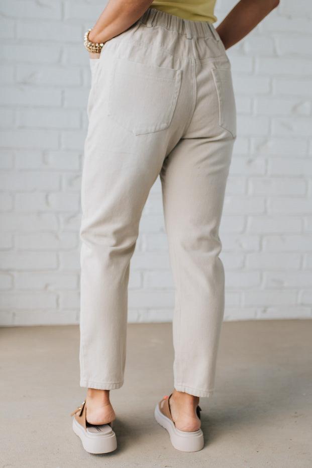 Blonde Woman in a Yellow Tank Wearing Vintage Washed Slim Barrel Pants With Front Patch Pockets and a Chunky Drawstring Waist.