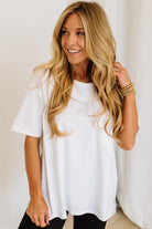 Woman wearing a white t-shirt with a plain background