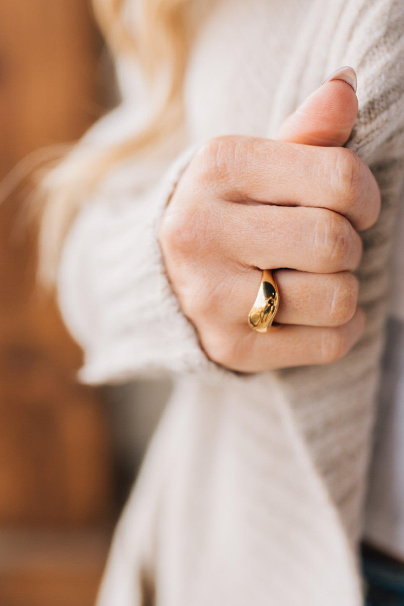 Trendy gold ring in a chunky wave design