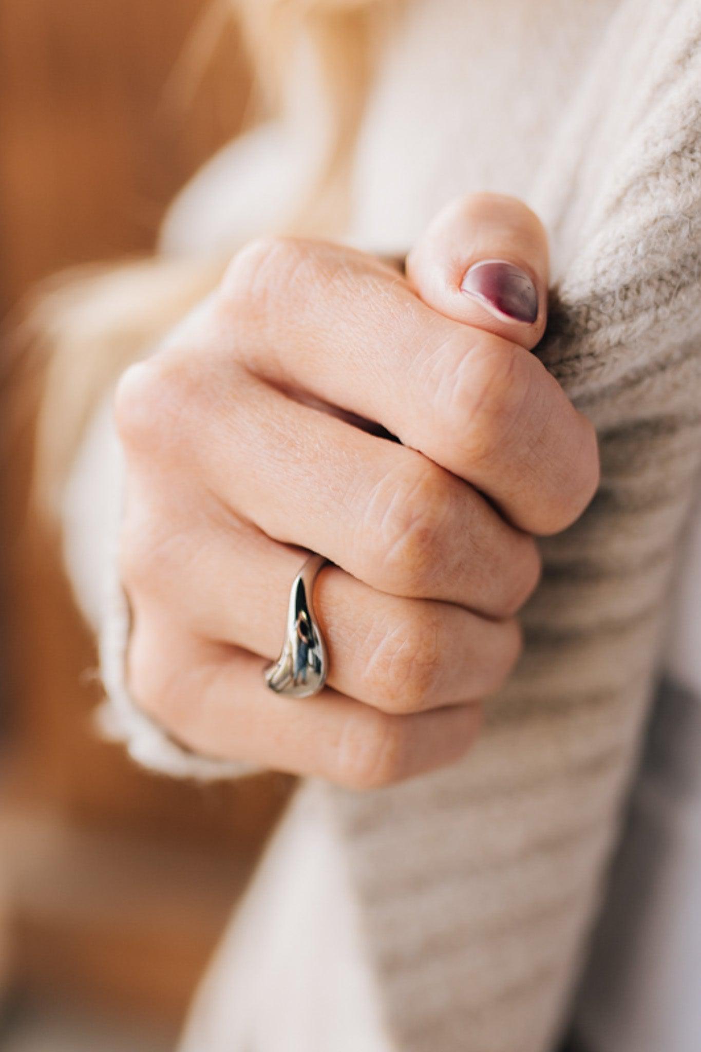 Trendy silver ring in a chunky wave design