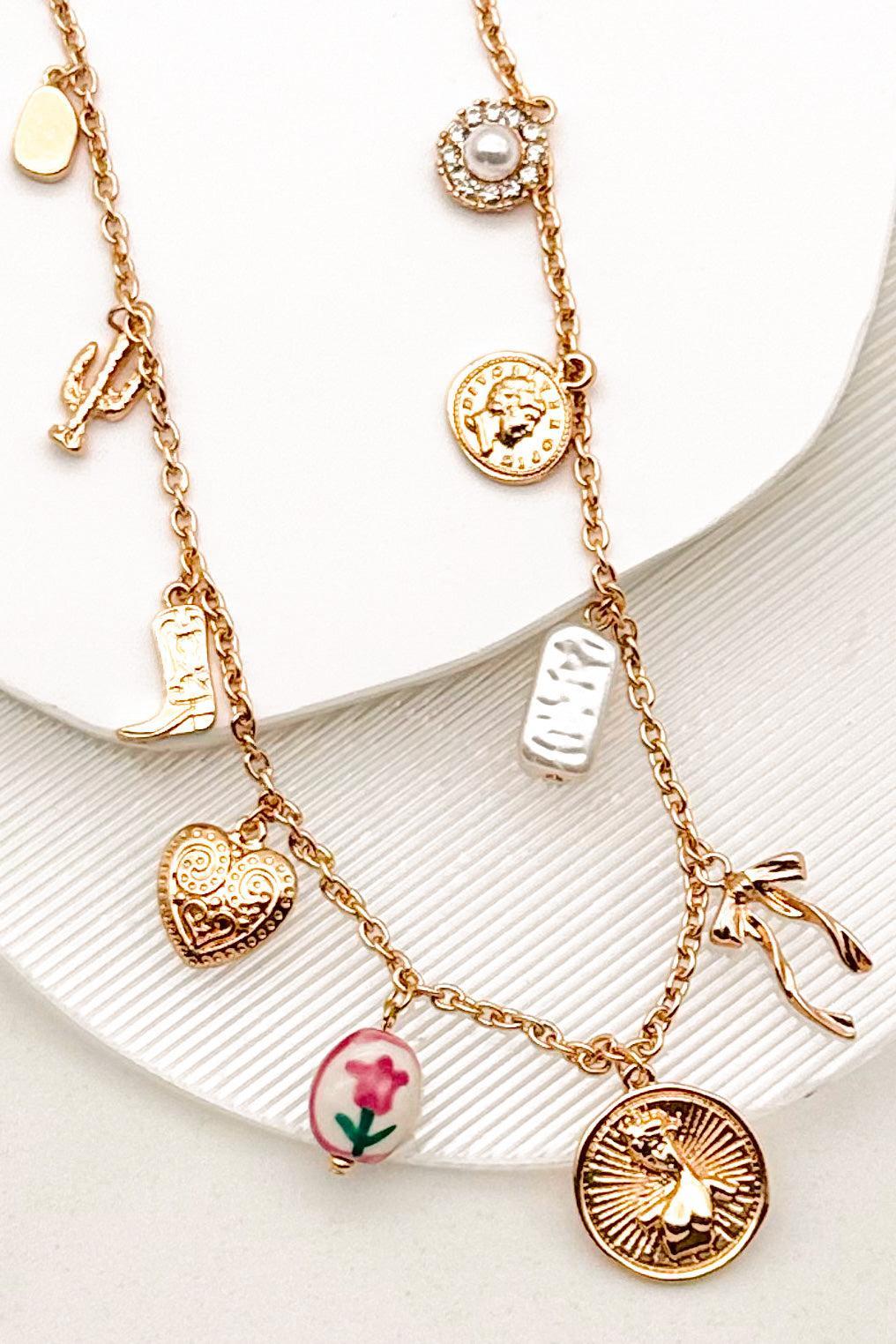 The gold-tone finish has real warmth to it, and because it's gold plated stainless steel, it holds up to everyday wear instead of hiding in a drawer for special occasions. The adjustable chain means you can drop it longer for layering or keep it closer to the collar.