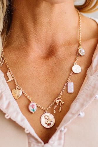 The gold-tone finish has real warmth to it, and because it's gold plated stainless steel, it holds up to everyday wear instead of hiding in a drawer for special occasions. The adjustable chain means you can drop it longer for layering or keep it closer to the collar.