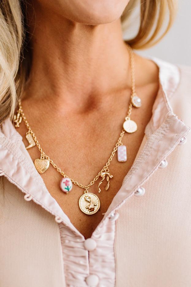 The gold-tone finish has real warmth to it, and because it's gold plated stainless steel, it holds up to everyday wear instead of hiding in a drawer for special occasions. The adjustable chain means you can drop it longer for layering or keep it closer to the collar.