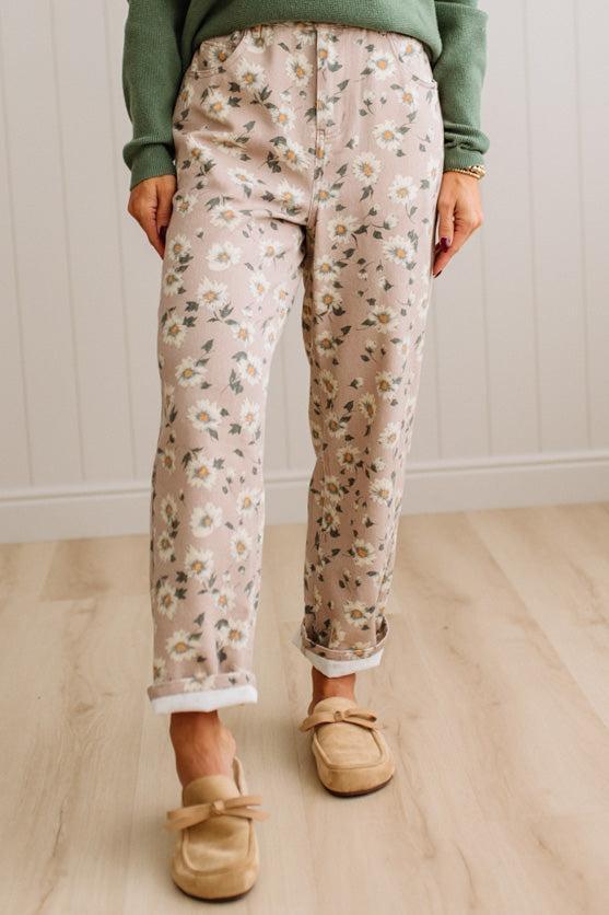 Woman Standing on Light Wood Floor with a Paneled Wall behind and wearing a green shirt, light tan slip on loafers and Delicate Wildflower Harmony Classic Fit Trouser Pants.