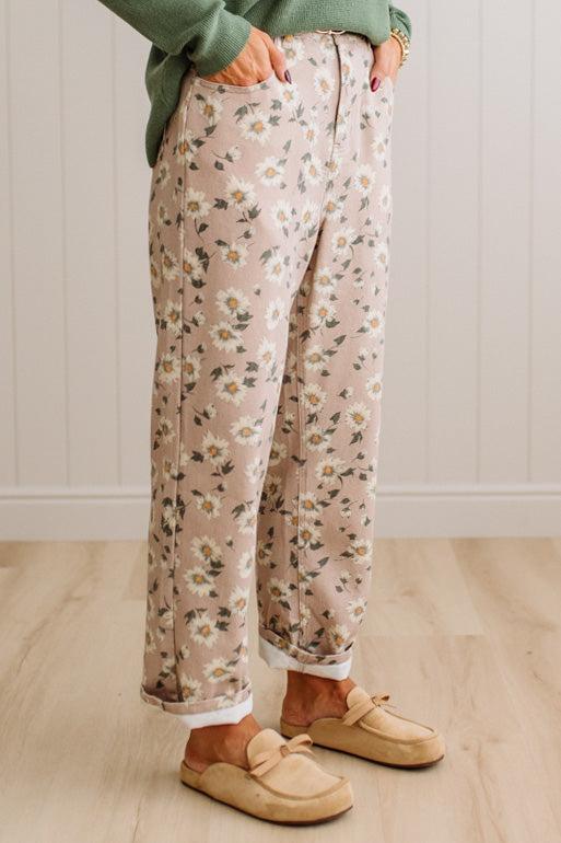 Woman Standing on Light Wood Floor with a Paneled Wall behind and wearing a green shirt, light tan slip on loafers and Delicate Wildflower Harmony Classic Fit Trouser Pants.