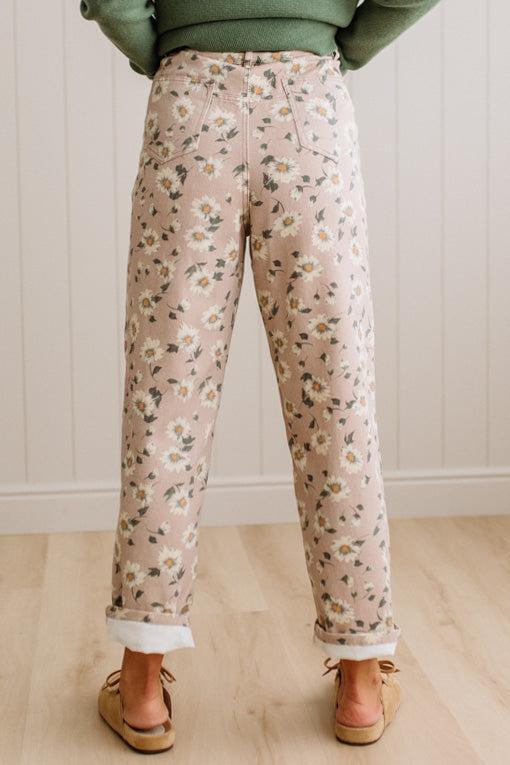 Woman Standing on Light Wood Floor with a Paneled Wall behind and wearing a green shirt, light tan slip on loafers and Delicate Wildflower Harmony Classic Fit Trouser Pants.