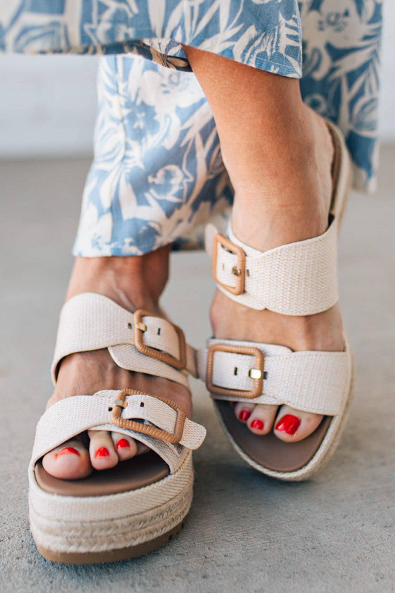 Double strap raffia platform sandals with espadrille base.