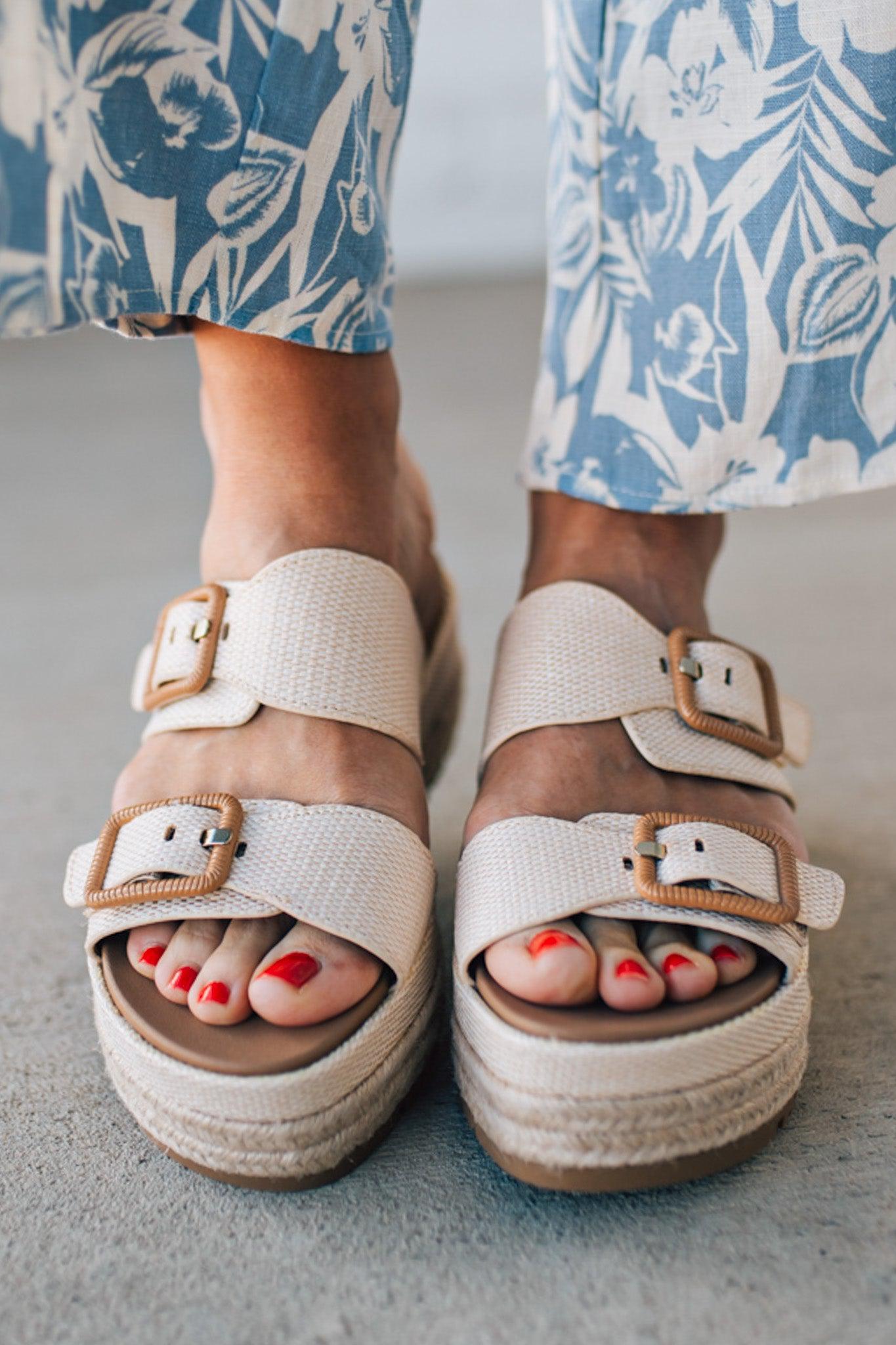 Double strap raffia platform sandals with espadrille base.