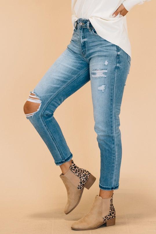 medium wash jeans with distressed accents