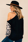 open shoulder top with animal print detail